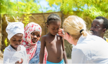 doctor checking child's face