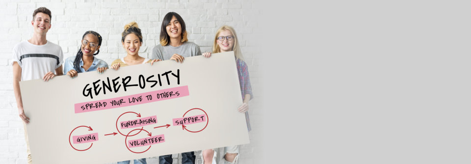 group of people holding generosity word in tarp